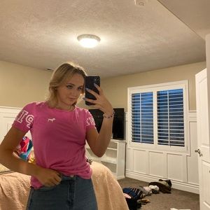 Pink loungewear shirt with details on the back and sleeves.